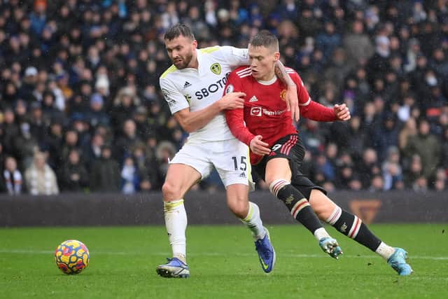 Stuart Dallas and Scott McTominay vie for the ball. Pic: Laurence Griffiths.