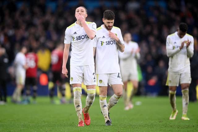 Luke Ayling and Mateusz Klich look dejected at full time. Pic: Laurence Grifiths.