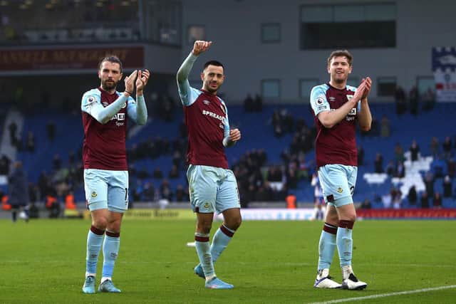 ON THE RISE: Clarets trio Jay Rodriguez, Dwight McNeil and Nathan Collins celebrate Burnley's 3-0 triumph at Brighton. Photo by Charlie Crowhurst/Getty Images.