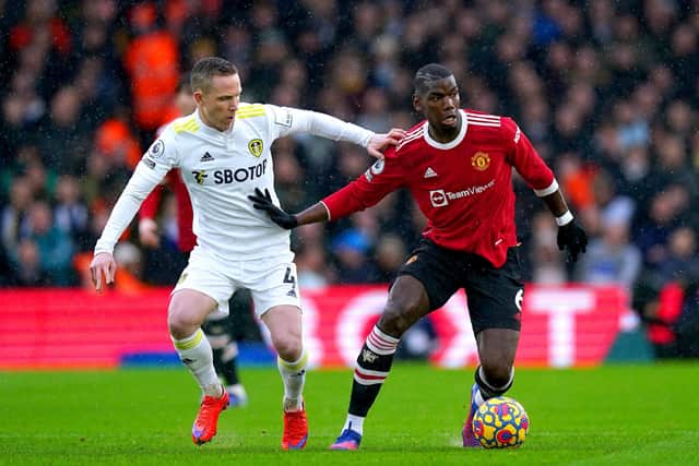 Leeds United man-of-the-match contender Adam Forshaw (left) tussles with Manchester United's Paul Pogba. Picture: Mike Egerton/PA Wire.