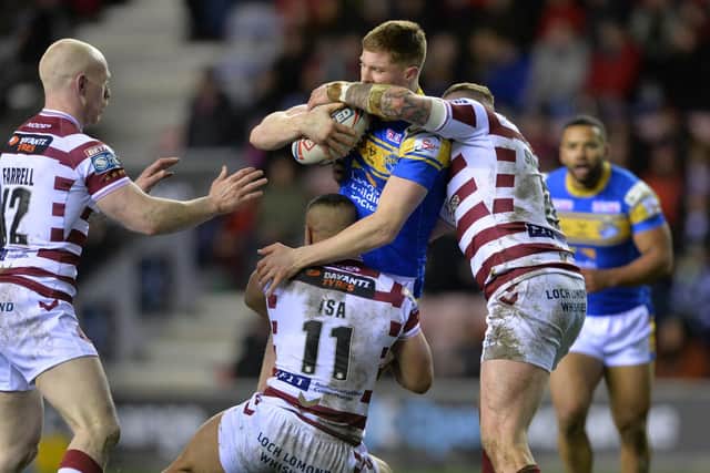 Morgan Gannon is tackled during Rhinos' defeat at Wigan. Picture by Bruce Rollinson.