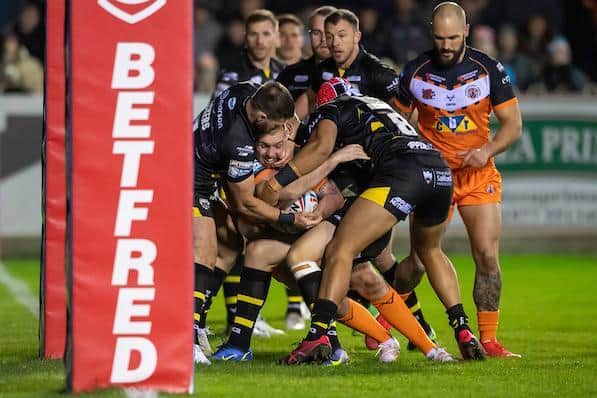 Daniel Smith is held up close to the line for Tigers against Salford. Picture by Allan McKenzie/SWpix.com.
