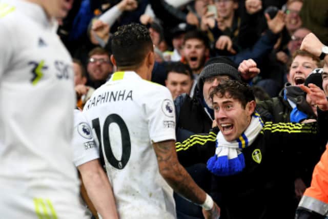 Raphinha celebrates scoring Leeds United's equaliser with the fans at Elland Road. Pic: Simon Hulme.
