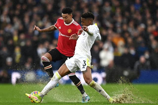 Junior Firpo challenges Jesse Lingard during Leeds United's 4-2 defeat to Manchester United on Sunday. Pic: Shaun Botterill.