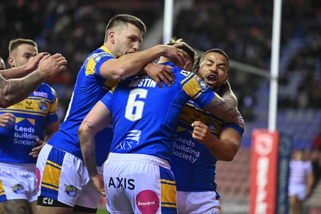 Blake Austin is congratulated after scoring Leeds Rhinos' first try against Wigan Warriors. Picture: Bruce Rollinson.
