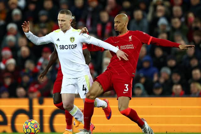 Fabinho challenges Adam Forshaw at Anfield. Pic: Clive Brunskill.