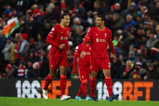 Virgil van Dijk and Joel Matip celebrate Liverpool's second goal during the Reds' 6-0 victory over Leeds United. Pic: Clive Brunskill.