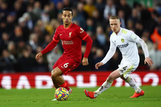 TOUGH NIGHT: Leeds United midfielder Adam Forshaw, right, tries to keep tabs on Liverpool's Thiago Alcantara during Wednesday night's 6-0 blitz at Anfield. Photo by Clive Brunskill/Getty Images.