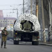 A Ukrainian soldier stands next to a military vehicle on a road in Kramatosrk, eastern Ukraine. Picture: AP Photo/Vadim Ghirda.