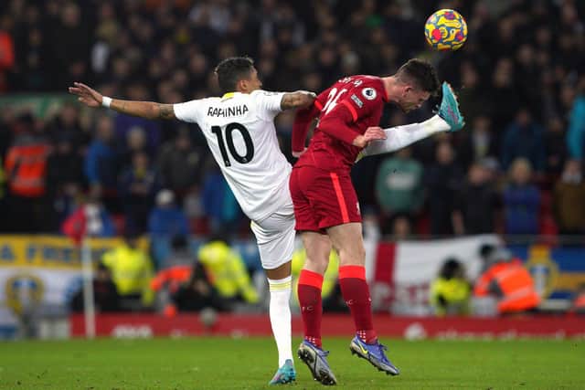 POOR NIGHT: For Leeds United star Raphinha, left, pictured battling Liverpool's Andrew Robertson in Wednesday night's 6-0 hammering at Anfield. Picture by Peter Byrne/PA Wire.