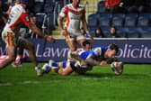 Blake Austin scores for Rhinos against Catalans. Picture by Jonathan Gawthorpe.