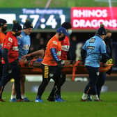 Alex Mellor was taken off the field on a stretcher just minutes into Rhinos' defeat by Catalans. Picture by Jonathan Gawthorpe.