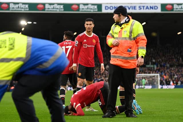 Manchester United winger Anthony Elanga is struck by an object at Elland Road. Pic: Shaun Botterill.