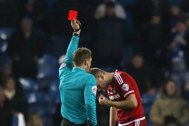 Craig Pawson shows Ben Gibson a red card at Elland Road. Pic: Alex Livesey.