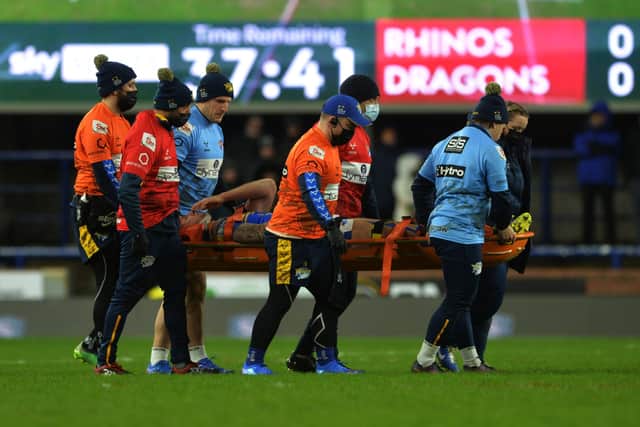 Leeds Rhinos' Alex Mellor leaves the pitch due to injury. 
Picture: Jonathan Gawthorpe.