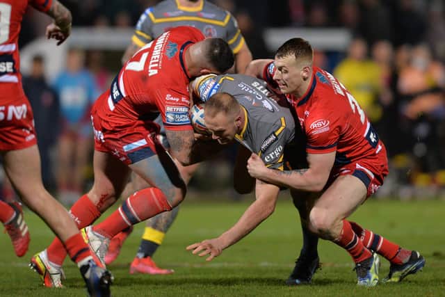 NO WAY THROUGH: Castleford Tigers' Liam Watts is stopped by Hull KR's Elliot Minchella and Frankie Halton at Craven Park Picture: Bruce Rollinson