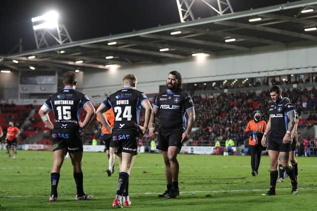 Wakefield Trinity players look dejected after defeat to St Helens. Picture: PA