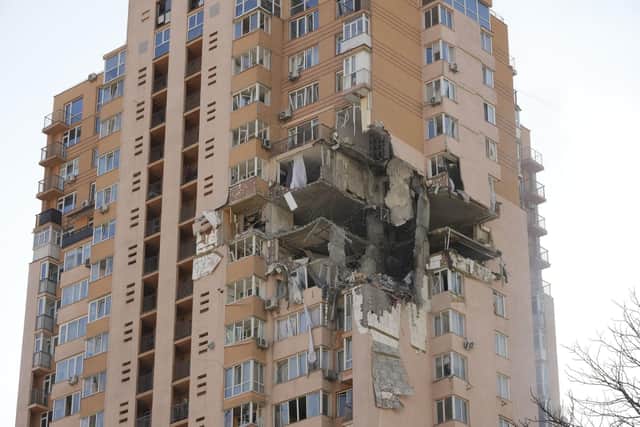 An apartment building damaged following a rocket attack on the city of Kyiv, Ukraine, on Saturday, February 26. Russian troops stormed toward Ukraine's capital  and street fighting broke out as city officials urged residents to take shelter. (AP Photo/Efrem Lukatsky)