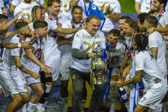 Marcelo Bielsa lifts the Championship trophy with his Leeds United players. Pic: Tony Johnson.