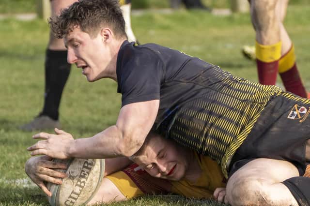 Try time for Sandal in their incredible points fest against Burnage. Picture Scott Merrylees