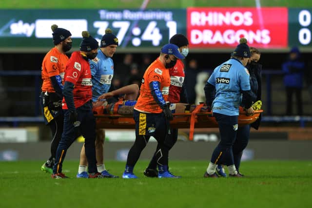 Alex Mellor leaves the pitch on a stretcher during the Catalans Dragons match. He was thankfully cleared of serious injury. Picture: Jonathan Gawthorpe.