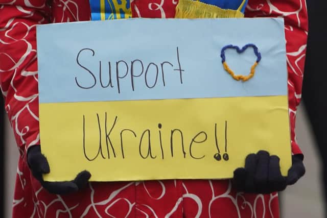 People protesting outside the Chinese Embassy in Dublin over the Russian invasion of Ukraine. Photo: PA/Niall Carson
