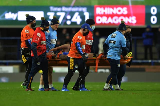 Leeds Rhinos' Alex Mellor leaves the pitch injured on a stretcher in last week's defeat to Catalans Dragons. Picture: Jonathan Gawthorpe