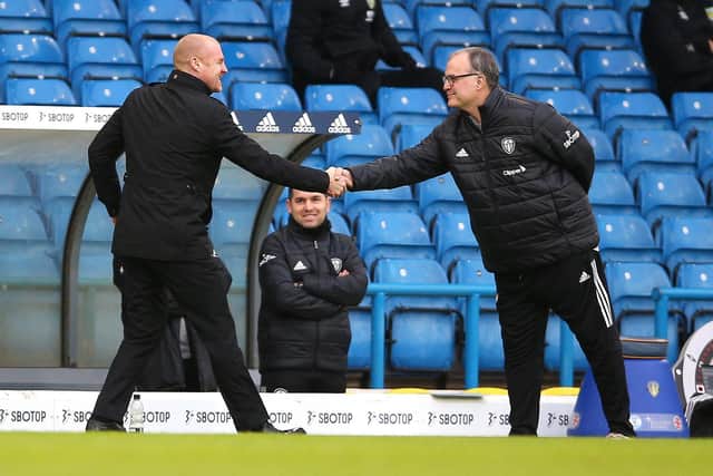 FORMER RIVALS: Burnley boss Sean Dyche. left, and ex-Leeds United head coach Marcelo Bielsa, right, before the Premier League clash between the Whites and Clarets at Elland Road of December 2020. Photo by Nigel French - Pool/Getty Images
