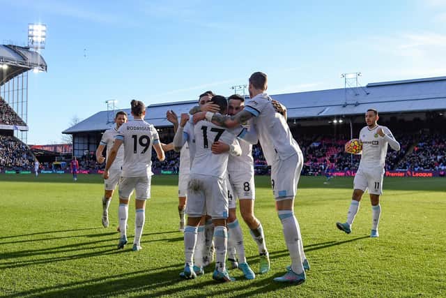 Burnley celebrate equalising against Crystal Palace at Selhurst Park. Pic: Tom Dulat.