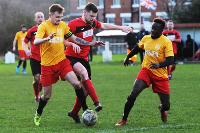 Luke Playford wins the ball  for Horbury Town at Robin Hood Athletic. Picture: Steve Riding.