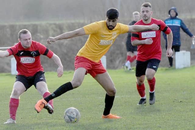 Saif Akbar shows some fancy footwork for Horbury Town during their 2-2 West Yorkshire League Premier Division draw at Robin Hood Athletic. Picture: Steve Riding.