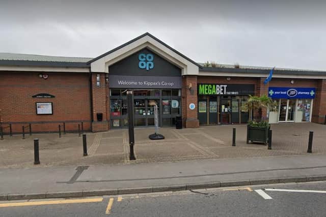 An investigation has been launched after a masked gang armed with machetes robbed a Co-op in Kippax.