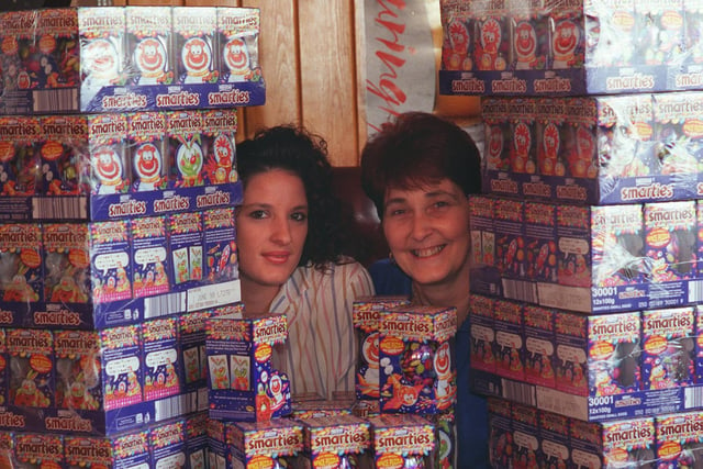 Lynda Rhodes (right) landlady of the Penda's Arms in Seacroft with barmaid Tracy Ponting, pictured with a stack of Easter eggs ready for distribution to children in hospital in April 1998.
