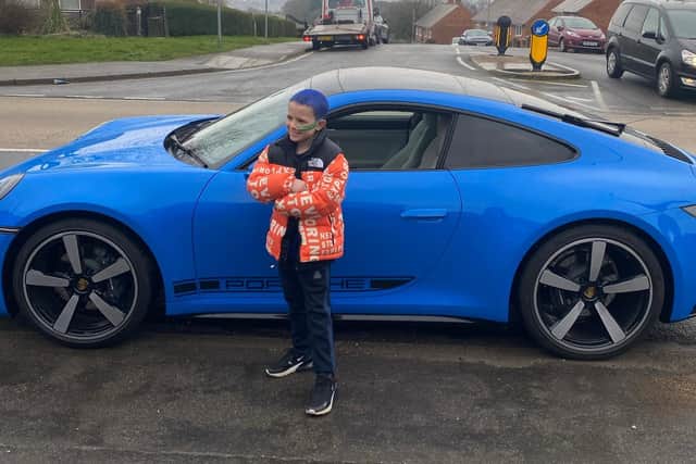Jude was chauffer driven through the gates in a sparkling blue Porsche car after being given the experience of looking around the showroom as a treat.