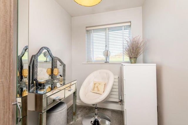 Currently used as a dressing room, bedroom three could also be used as a nursery or home office.