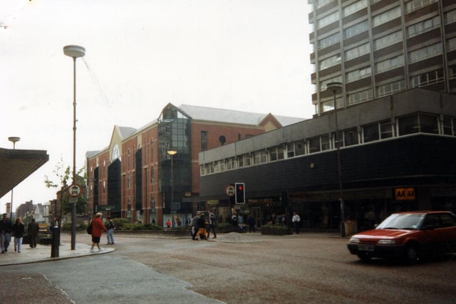 The Headrow from the junction with Albion Street, taken in the spring of 1991. On the right is Cavendish House, with the Automobile Association and Whitegates estate agents, among others, occupying the ground floor. To the left of this, after the junction with King Charles Street, is the Schofields Centre.