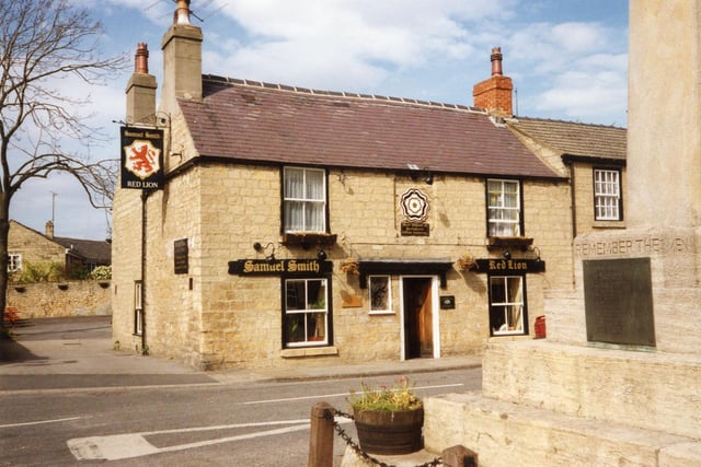Did you enjoy a drink here back in the day? The Square at the bottom of Town Hill in Bramham, showing the Red Lion, a Samuel Smith public house. In the foreground, right, is the war memorial commemorating the villagers who lost their lives in the two world wars.