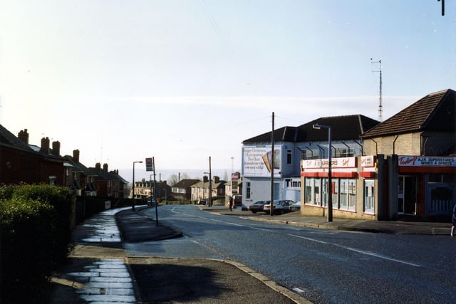 Osmondthorpe Lane in January 1991, showing A.J.R. Superstores, general grocer and off licence, at no. 84 on the right. Beyond this is Timmerdales ice cream factory with an advertising hoarding on the wall.
