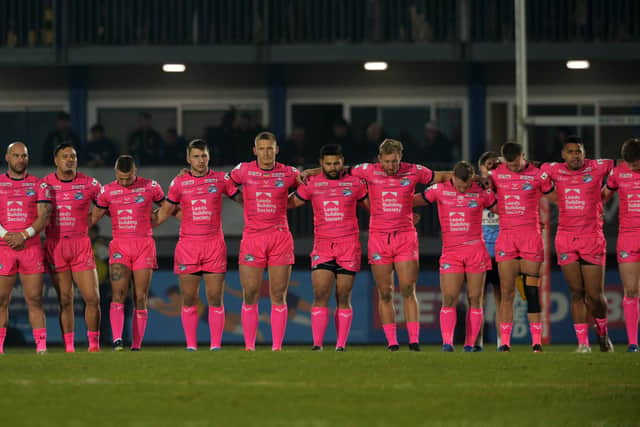 Rhinos line up before last night's game during a moment of solidarity with the people of Ukraine. Picture by Jonathan Gawthorpe.
