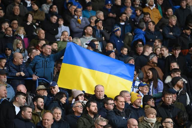 Leeds United fans wave a Ukraine flag in the away end. Pic: Geoff Caddick.