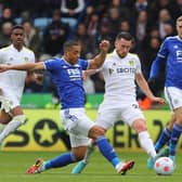 Youri Tielemans and Jack Harrison vie for the ball.