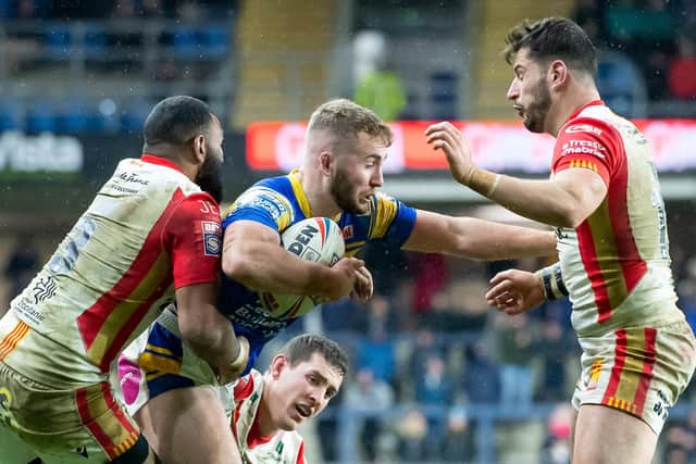 Leeds Rhinos' Jarrod O'Connor is tackled by Catalans Dragons' Samisoni Langi, Matt Whitley and Benjamin Garcia last week. Picture: Allan McKenzie/SWpix.com.