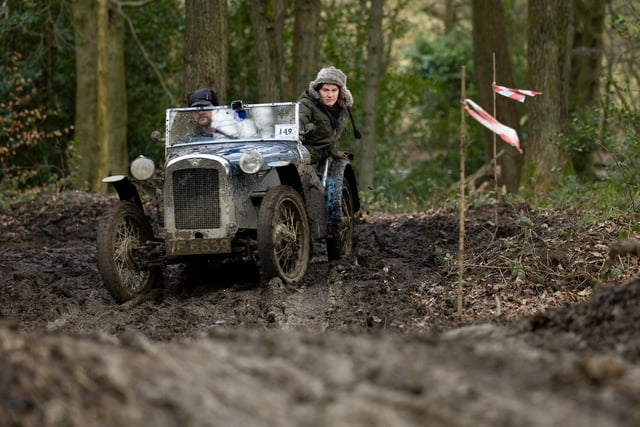 Andrew Wright and companion at full tilt during the 14th and final section of the John Harris Trial. The competition saw 100 vintage cars slither along muddy lanes and tracks, around Ashover, near Chesterfield, Derbyshire. Photo: Rod Kirkpatrick/F Stop Press