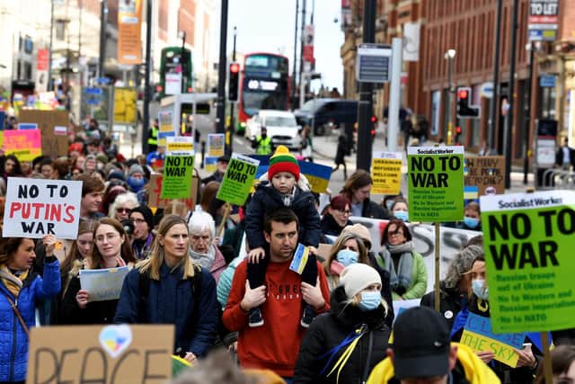 Anti-war protestors marched from Briggate to Leeds Town Hall.