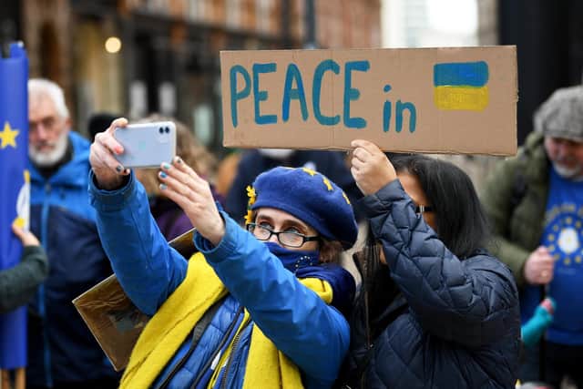 Many of the protestors wore blue and yellow to show their solidarity with Ukraine.