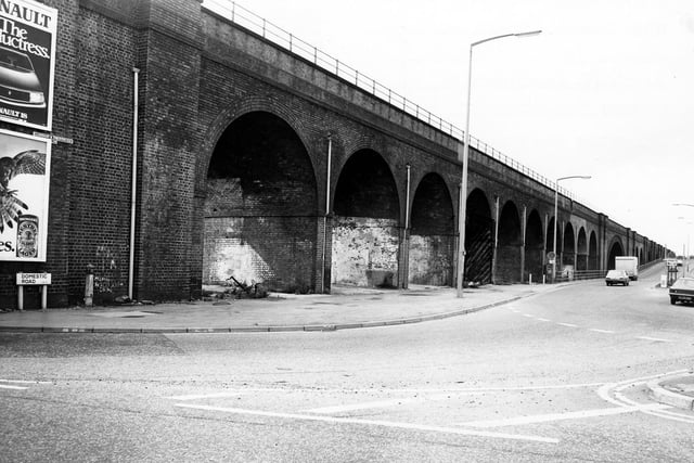 The railway viaduct which crosses Domestic Street pictured in February 1980. Domestic Road can be seen going off on the right. The proposed site for a new advertising hoarding is marked on the photograph in front of one of the arches.