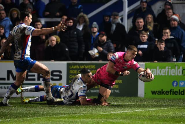 Leeds 
Rhinos' Ash Handley scores his first try against Wakefield Trinity. 
Picture: Jonathan Gawthorpe.