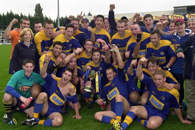 Rhinos celebrate their academy Grand Final win on October 13, 2002. Picture by Mel Hulme.