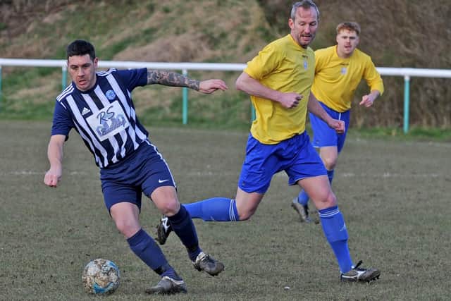 Dec Forbes, of Wortley, turns Farsley Celtic Juniors' Andy Shields during Saturday's 3-0 West Riding County FA Challenge Cup semi-final win. Picture: Steve Riding.