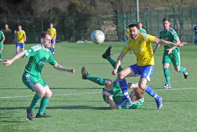 Horsforth St Margarets goalscorer Loz Power of Horsforth causes havoc for the Beeston St Anthony defence. Picture: Steve Riding.